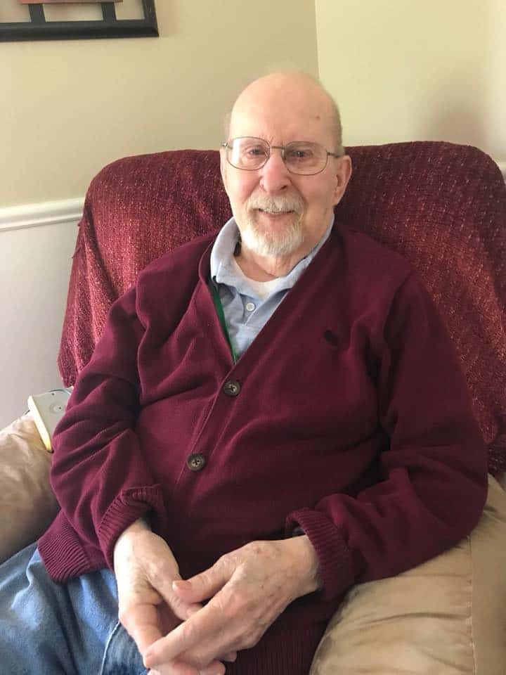 senior independent living resident relaxing in chair